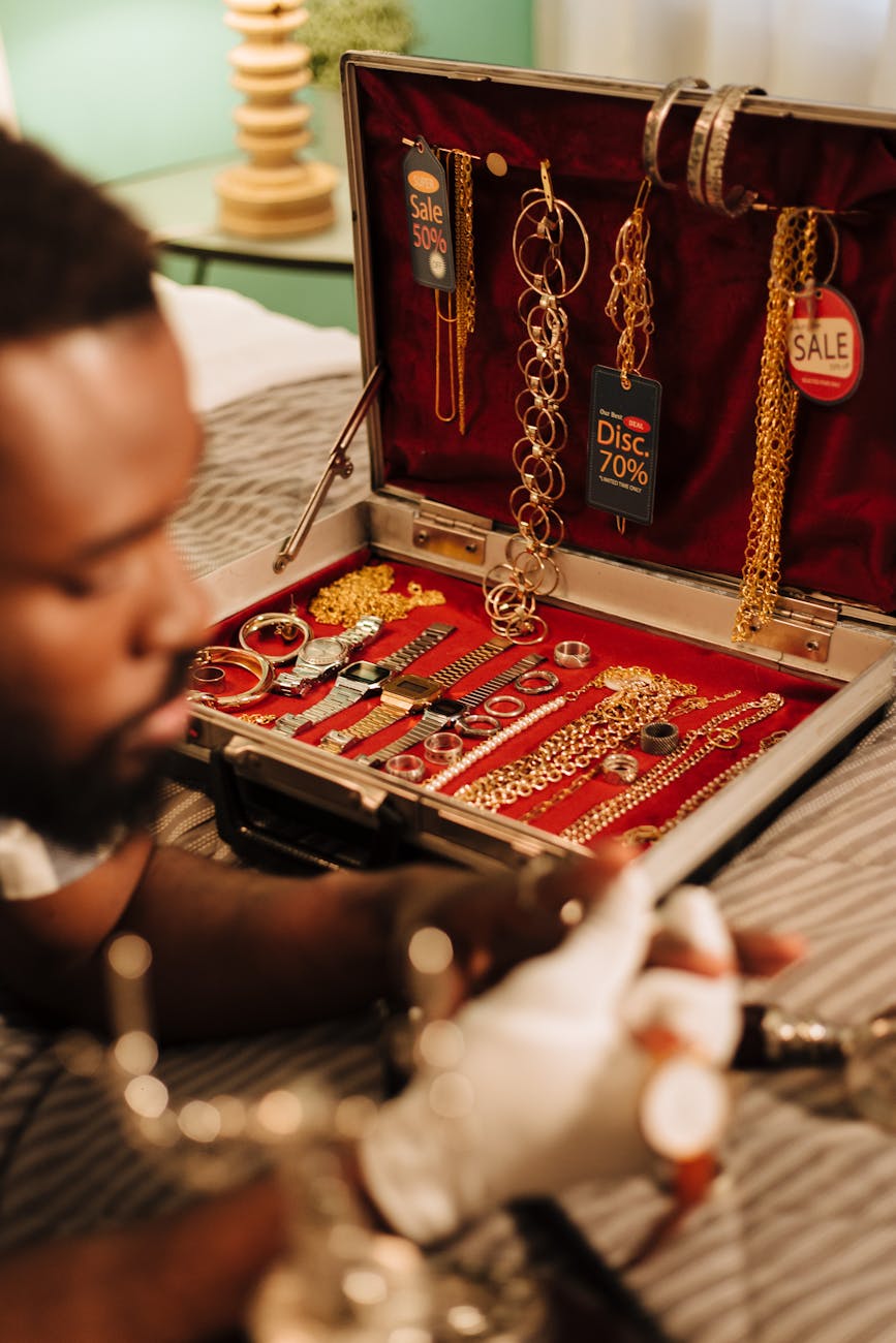 watches and jewelries on red surface